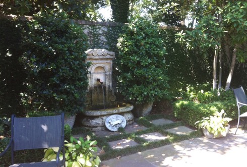 english style garden with fountain